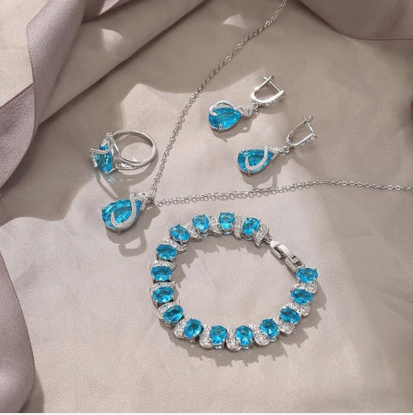 Screenshot 2025-12-02 223130 Ever Faith Women's Jewellery Set Sparkly Cubic Zirconia Teardrop Necklace Earring Bracelet Ring – Sky Blue Silver-Tone